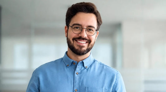 A Men wearing Titanium Black Round Reading Glasses in a blue shirt