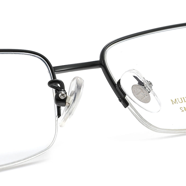 Close-up of a pair of black pure titanium half frame glasses for men from Verhalo Vision with clear silicone nose pads on a white background.