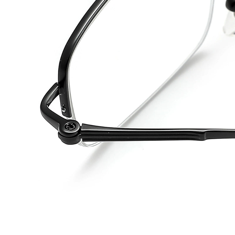 Close-up of a black pure titanium half frame glasses corner with clear lenses on a white background.