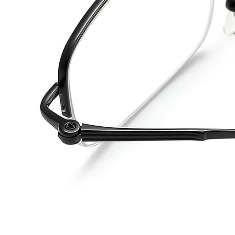 Close-up of a black pure titanium half frame glasses corner with clear lenses on a white background.