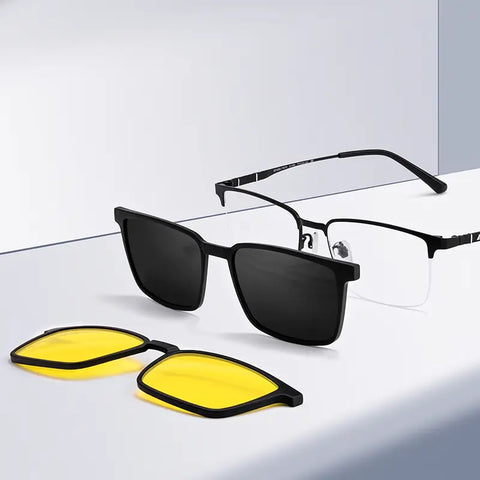 Black pure titanium semi-rimless magnetic glasses frames from Verhalo Vision with dark lenses and a pair of yellow-tinted clip-on lenses, displayed on a clean white surface.