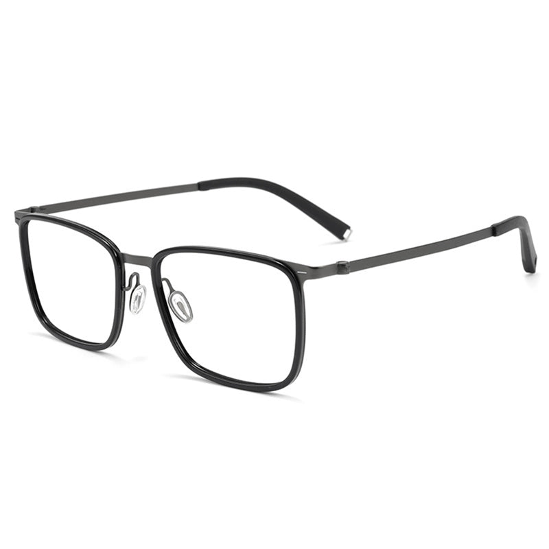 Black titanium rectangular eyeglasses with clear lenses and thin titanium temples, shown at an angle on a white background.