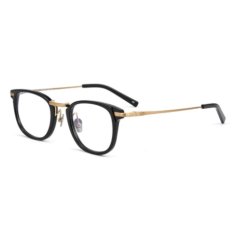 Black and gold round-frame designer titanium eyeglasses with clear lenses, displayed on a clean white background.