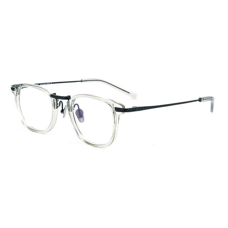 A pair of designer titanium eyeglasses featuring a clear acetate front frame with a thin black pure titanium bridge and temples, shown on a plain white background.