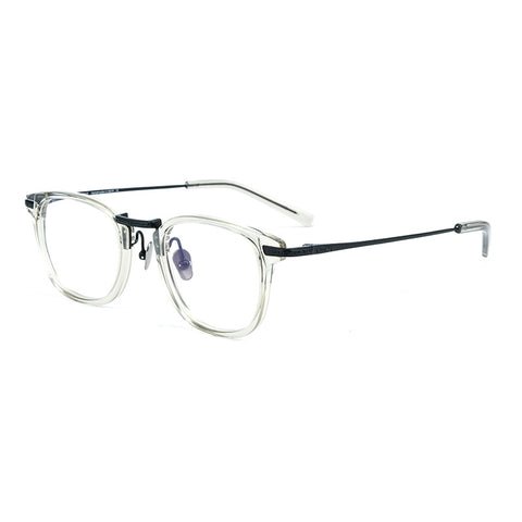 A pair of designer titanium eyeglasses featuring a clear acetate front frame with a thin black pure titanium bridge and temples, shown on a plain white background.