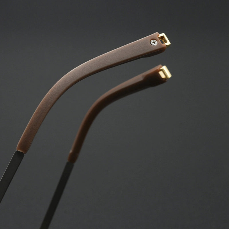 Close-up of two curved eyeglass temple arms with brown textured grips and gold metal tips, set against a dark gray background.