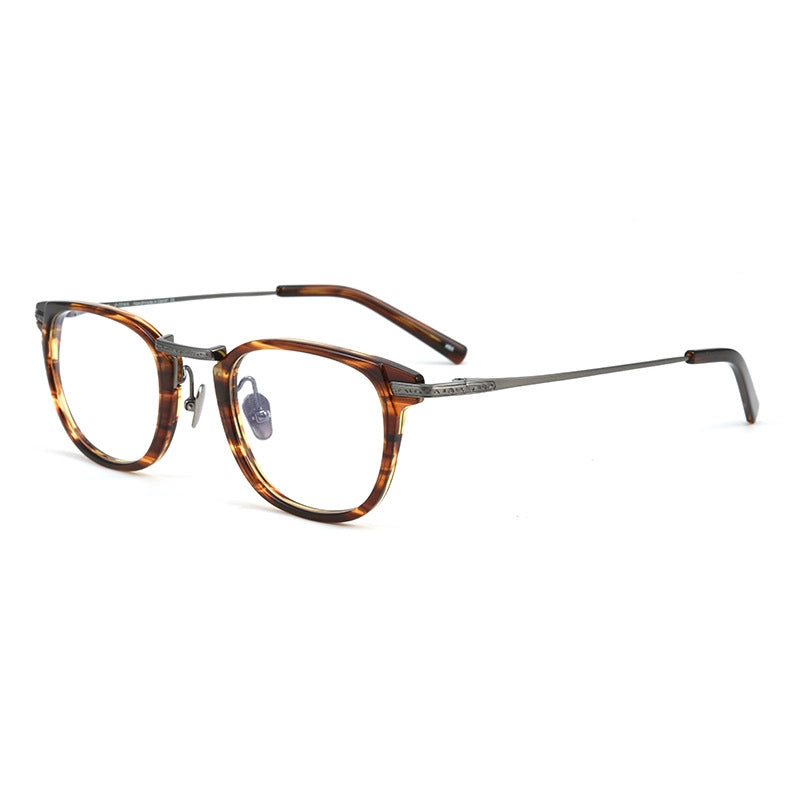 A pair of vintage-style designer titanium eyeglasses featuring a brown and amber tortoiseshell acetate frame with thin dark pure titanium metal temples, shown on a plain white background.