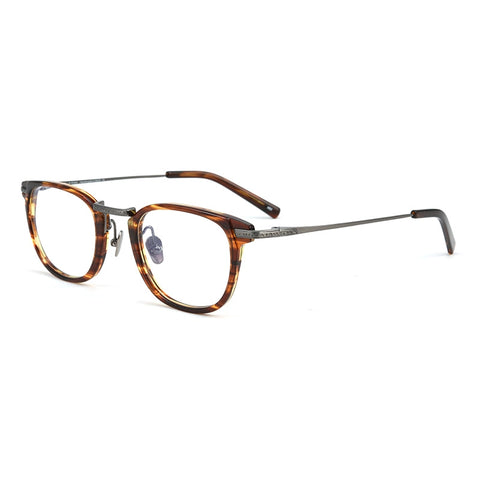 A pair of vintage-style designer titanium eyeglasses featuring a brown and amber tortoiseshell acetate frame with thin dark pure titanium metal temples, shown on a plain white background.
